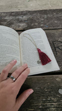 Load image into Gallery viewer, silver chain bookmark with burgundy tassel on top of a book