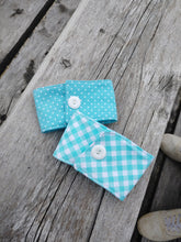 Load image into Gallery viewer, blue and white check drink coze beside white polka dot with blue back ground drink cozies