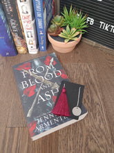 Load image into Gallery viewer, silver chain bookmark with burgundy tassel on top of a book