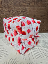 Load image into Gallery viewer, end view of cosmetic bag abstract red and pink poppy flower with black stem on white back ground with white zipper 
