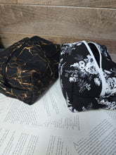 Load image into Gallery viewer, brown marble cosmetic bag beside black and white floral cosmetic back with wooden back ground
