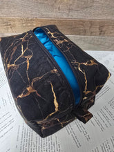 Load image into Gallery viewer, Black marble-patterned pouch with blue interior 
