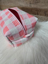 Load image into Gallery viewer, Pink and white checkered pouch on a fluffy white surface
