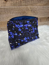 Load image into Gallery viewer, Blue and black star-patterned bag on a wooden surface with white fur background
