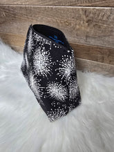 Load image into Gallery viewer, Black pouch with white floral pattern on a wooden surface and white fur background
